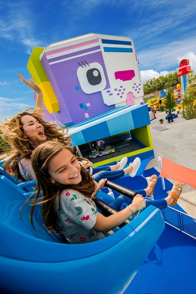 mom and daughter on LEGO Movie World ride at LEGOLAND Florida Resort in Winter Haven, FL