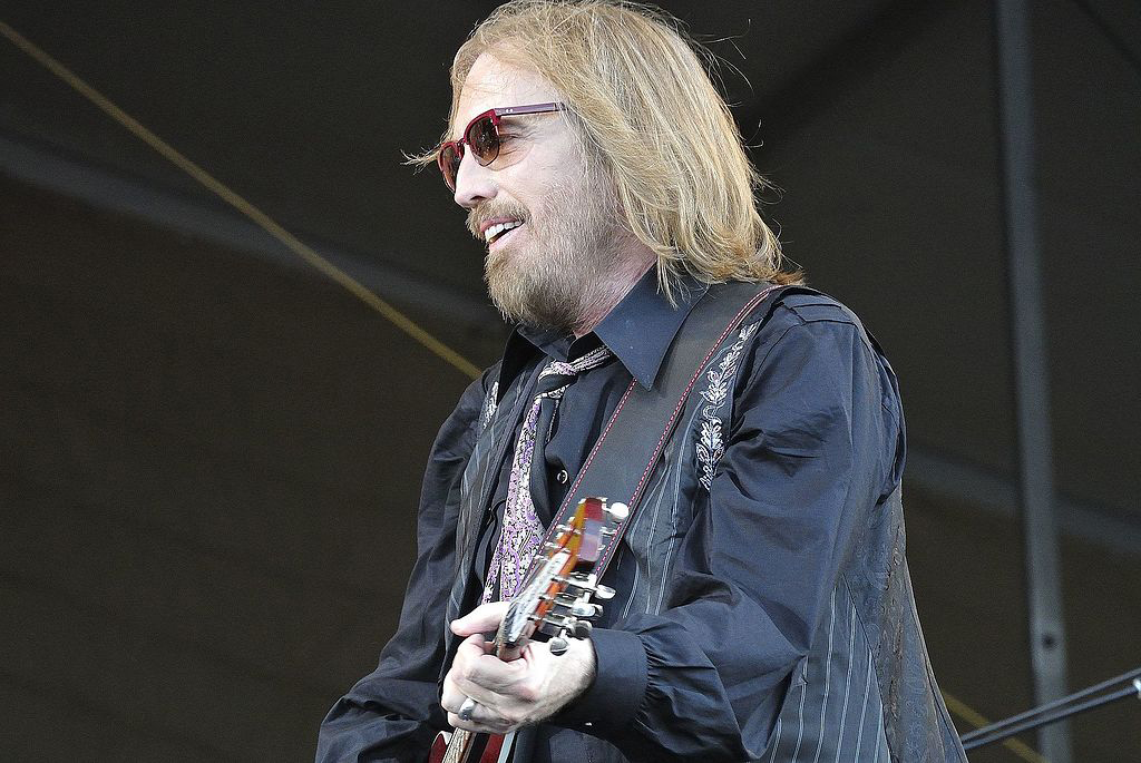 Tom Petty performing with guitar