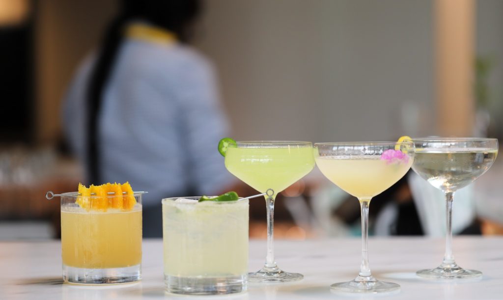 cocktails lined up at the bar