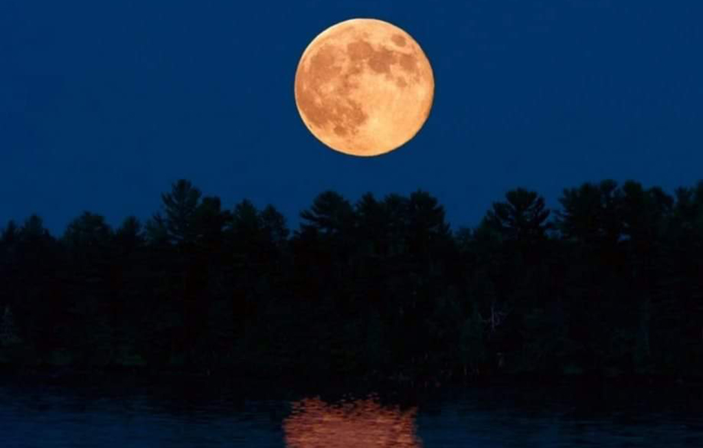 full moon over the river