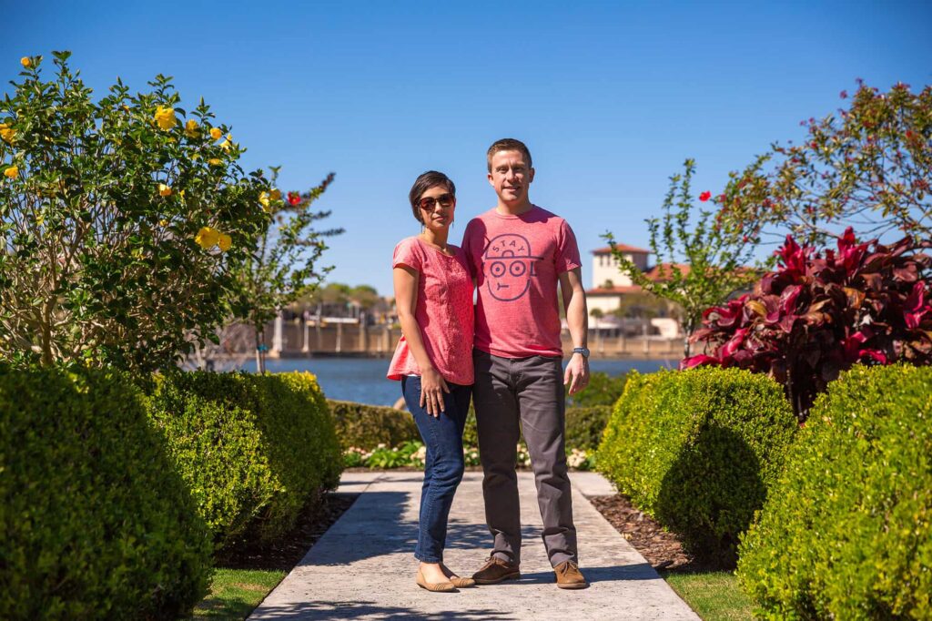 couple posing at Hollis Garden in Lakeland on Lake Mirror