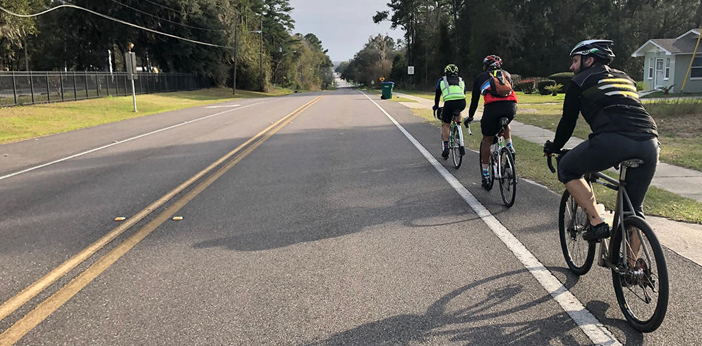 cyclists riding through town