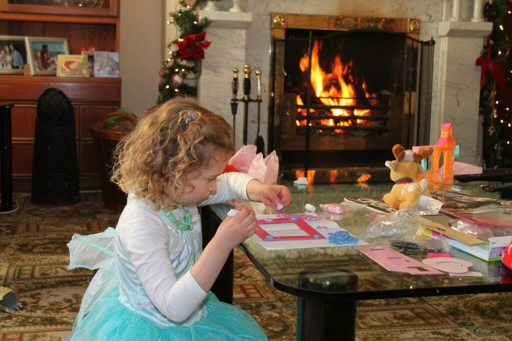 Christ Follenus' Christmas Tradition: Rebecca at the fireplace