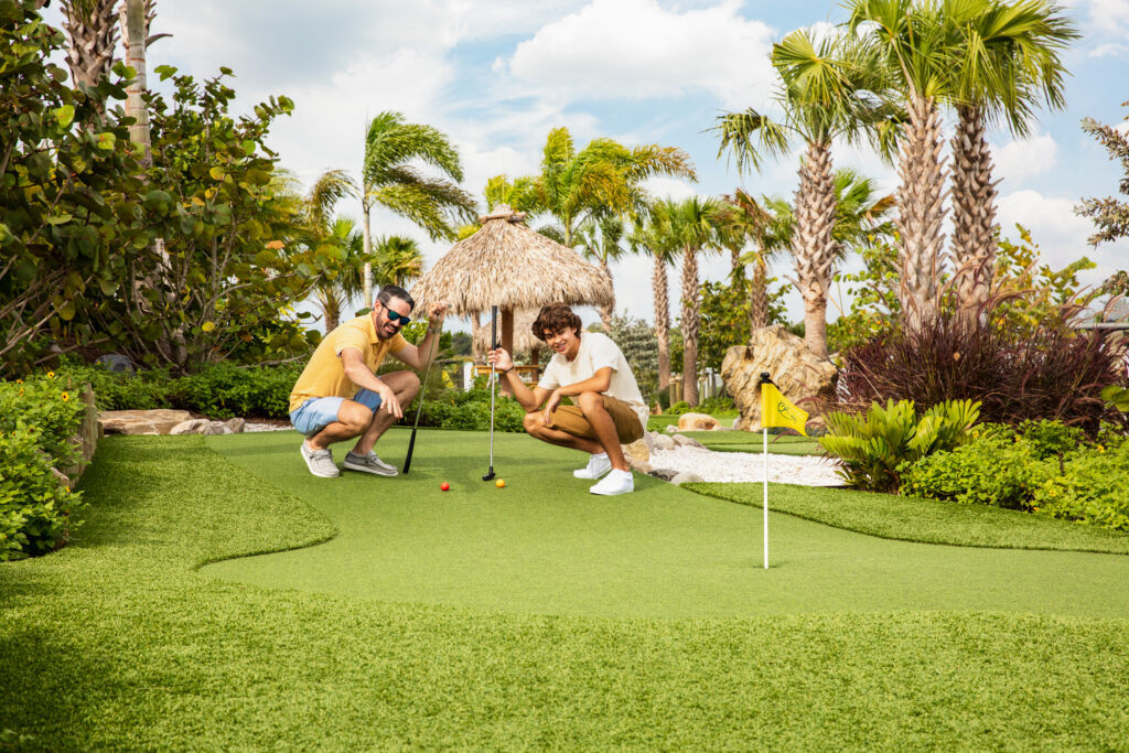 Father and son at putting green