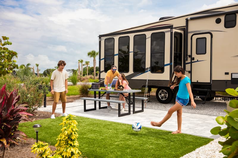 Family Playing Soccer at RV Site