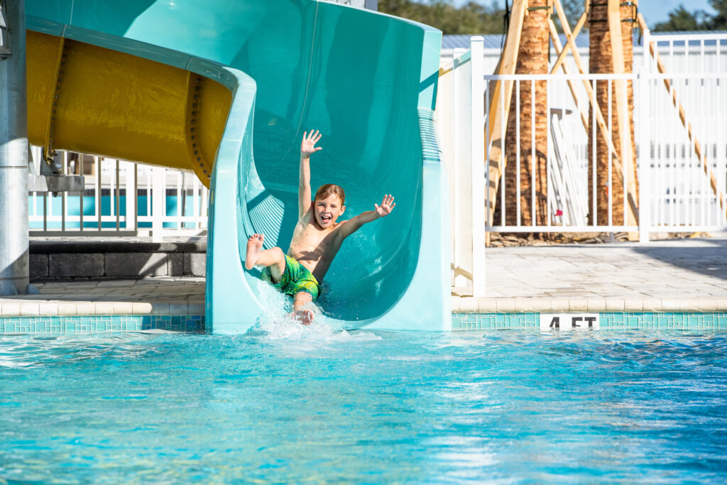 Boy on water slide