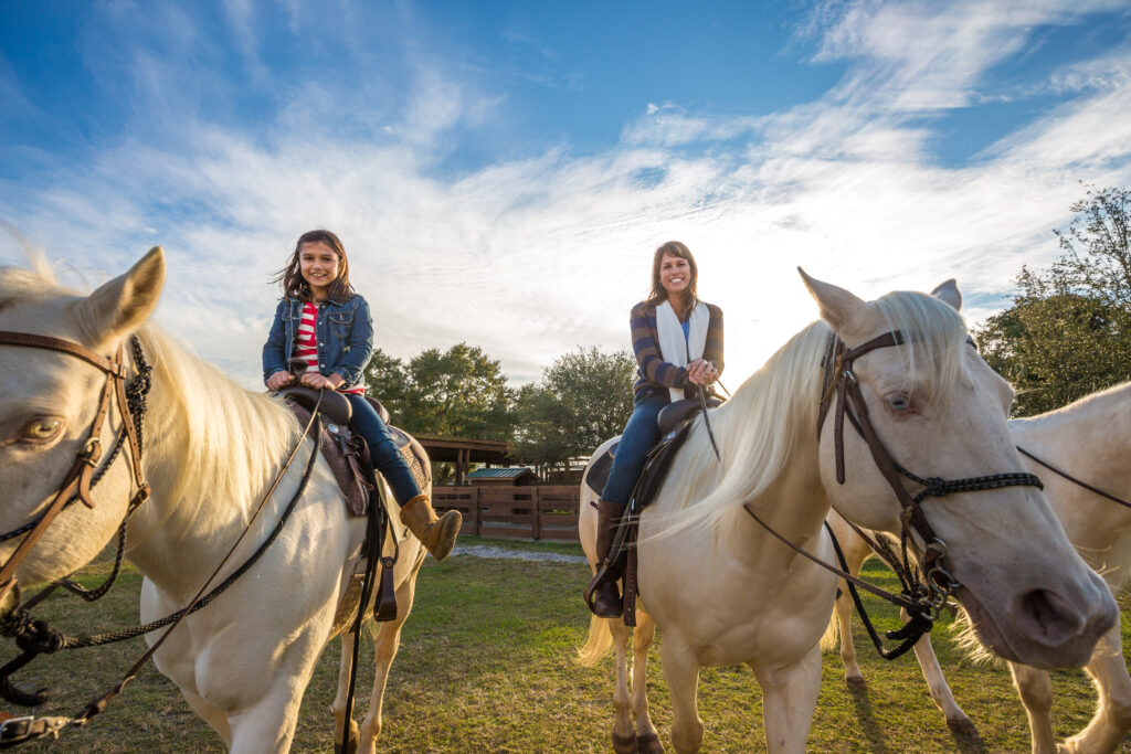 Mother and daughter on horses at River Ranch