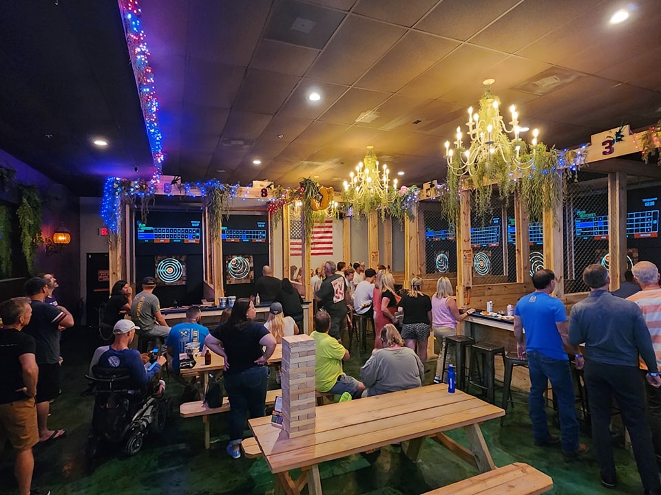 A group of people enjoying themselves at Madd Hatcher's Axe Throwing Lounge in Stuart, FL