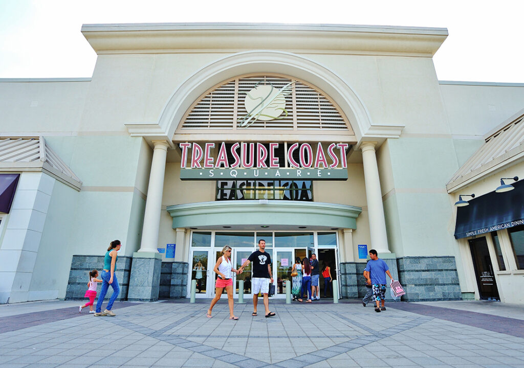 Shoppers walking outside the entrance to the Treasure Coast Square Mall